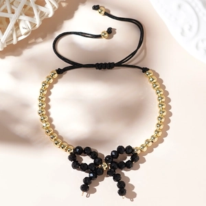Bracciale di perline placcato oro 18K con fiocco nero e cordino regolabile da donna