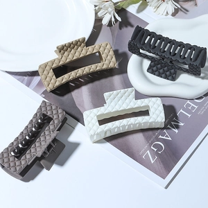Matte finish large hair claws with quilted texture set in beige black white and grey