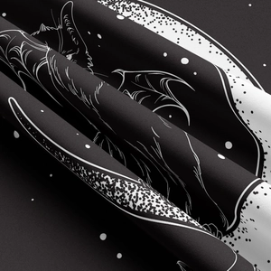 Macro detail of high-quality black tapestry fabric with white bat and moon printing