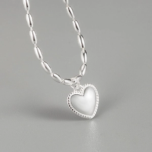 Minimalist 925 sterling silver heart pendant necklace with beaded border and oval bead chain