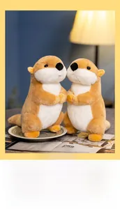 Close-up of cute plush groundhog dolls in a warm indoor setting showing soft texture