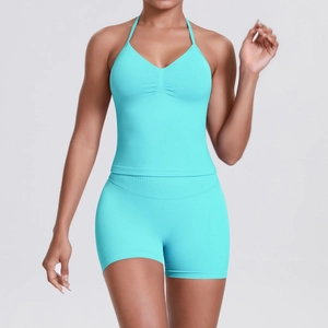 Close-up of cyan seamless ribbed knit yoga set showing texture of top and shorts