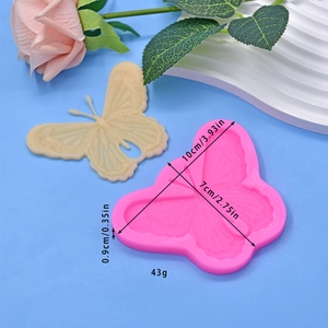 Pink butterfly silicone mold for cake mousse and chocolate with detailed wing textures