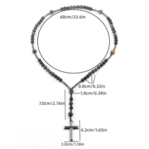 Detailed view of rosary necklace featuring natural tiger eye beads and metal cross pendant