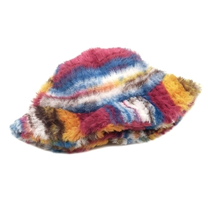 Close-up of thick faux fur bucket hat with vibrant rainbow stripes and plush texture