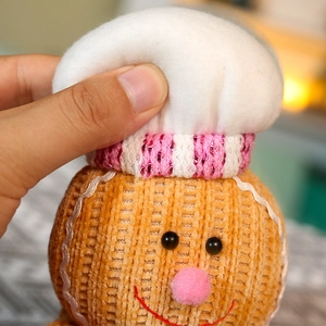 Standing gingerbread man plush toy in chef hat made of soft corduroy fabric for Christmas