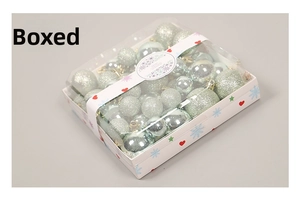 Detail of silver and light blue Christmas ball ornaments set in a festive gift box