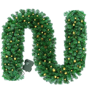 Detail of 9ft Christmas garland with warm LED lights and integrated battery timer box