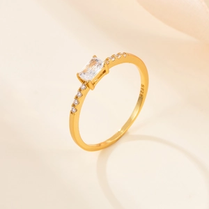 Close-up of S925 sterling silver ring with rectangular crystal and gold finish