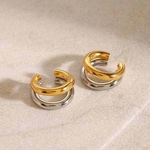 Two-tone 18K gold and silver stainless steel double-layered C-shaped ear cuffs on stone