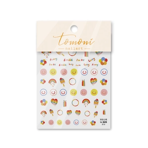 Detail showing thin nail art stickers with colorful smiles, rainbows, and floral patterns