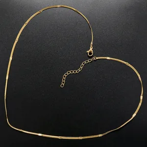Detail view of 18K gold plated snake chain necklace with heart-shaped layout