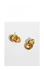 Macro detail of interlocking gold plated double circle stud earrings with a polished finish