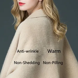 Beige faux mink fur knit poncho with sleeves featuring thick high-density plush texture