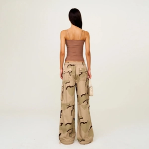 Rear view of brown slim fit camisole paired with desert camouflage cargo pants