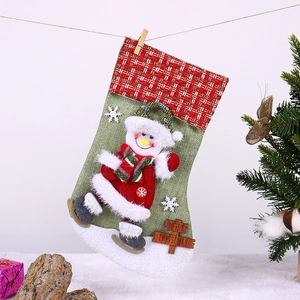 Detail of 3D snowman skiing on a plaid Christmas stocking with Merry Christmas wood sign