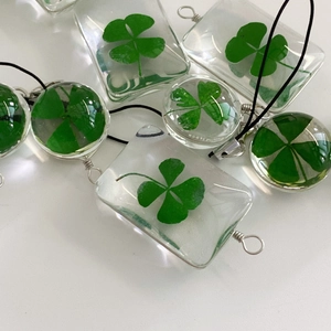 Handmade green four leaf clover resin pendants with silver wire wrap and black cord
