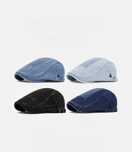 Detail view of denim newsboy caps in four colors featuring side metal adjustment buckles