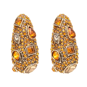 Vintage geometric drop earrings with amber rhinestones and gold-tone finish on white background