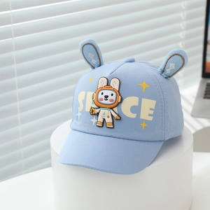 Detail of light blue cotton baseball cap with 3D bunny ears and cute space rabbit applique