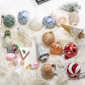 Assorted Christmas glass ornaments featuring multi-color unique shapes and glitter details