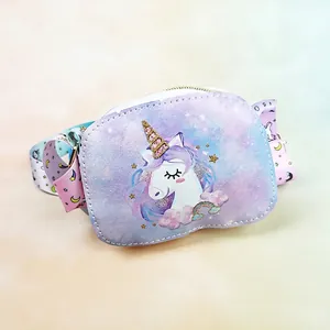 Detail of purple unicorn kids crossbody bag with cartoon print and adjustable strap
