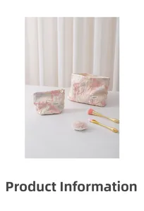 Detail of two floral embossed cosmetic bags with premium jacquard fabric and gold zippers