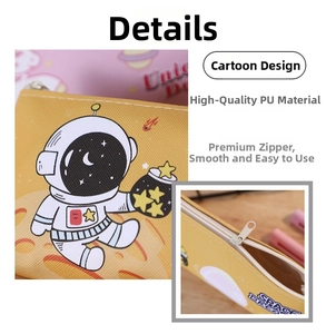 Detail of yellow PU pencil case featuring cartoon astronaut and smooth zipper closure