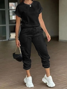 Detailed view of women's black short sleeve t-shirt and cargo jogger pants set with drawstring