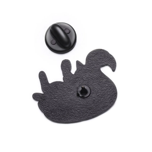 Detail of the hammered metal brooch back with secure black rubber clutch butterfly pin