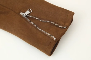 Detailed close-up of a silver zipper on a premium brown textured fabric sleeve
