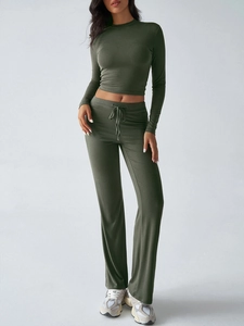 Detailed knit texture of Y2K slim long sleeve crop top and straight pants in dark green