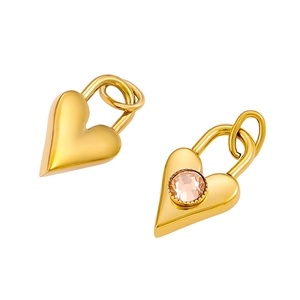 Detail of golden heart lock pendants featuring one smooth finish and one pink zircon stone