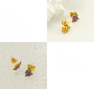 Detailed macro view of grape-shaped stud earring with purple zircon stones and green leaf