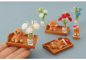 Miniature gingerbread man figures with tiny tray and Hope glass vase on hand
