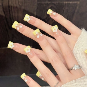 Pink and yellow floral press-on nails with white 3D flowers and pearl accents