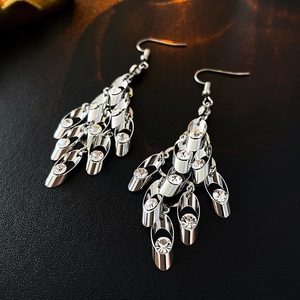 Detailed view of silver tassel earrings with zircon leaf sequins and fish hook ear hooks
