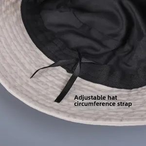 Detail view of the inner adjustable drawstring for sizing bucket hats with black lining