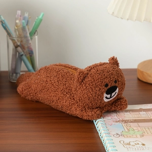 Close-up of a brown plush bear pencil case featuring soft fleece texture and sturdy zipper