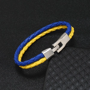 Handmade braided leather bracelet featuring blue and yellow flag colors with metal clasp