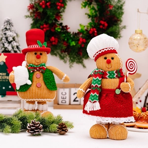 Detailed close-up of knitted gingerbread man figurines with festive Christmas decorations
