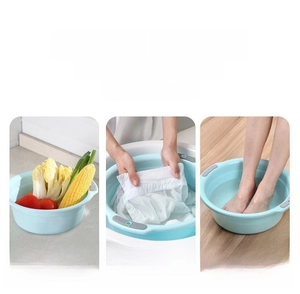Collapsible plastic basin set in light blue for washing vegetables and laundry