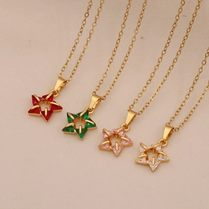 Close-up of star pendants featuring colorful zircon crystals on delicate gold chains