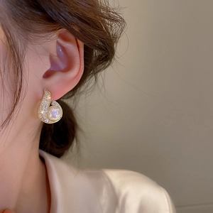 Elegant gold teardrop earrings with mermaid pearls and sparkling pavé zircon stones