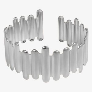 Detailed view of silver irregular open cuff bracelet with polished vertical bar design