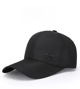 Close-up of black baseball cap with mesh texture and eagle spirit triangular metal tag