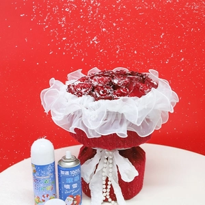 Christmas red rose bouquet set with artificial snow spray cans for festive holiday decor