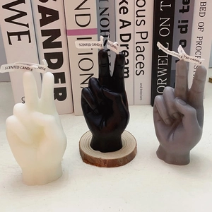 Creative victory gesture scented candles in white, black and gray with wooden base