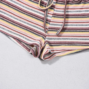 Detailed macro view of colorful striped knit shorts showing texture and drawstring detail