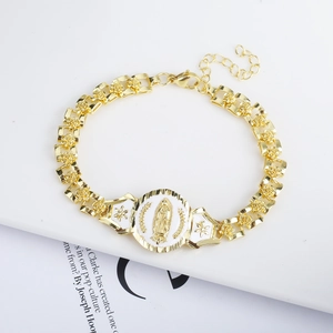 Macro detail of 18K gold-plated chain bracelet with Guadalupe medal and rose engravings